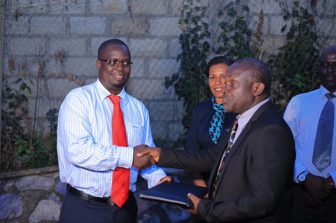 Lilly Ajarova Hands over to Dr Joshua Rukundo